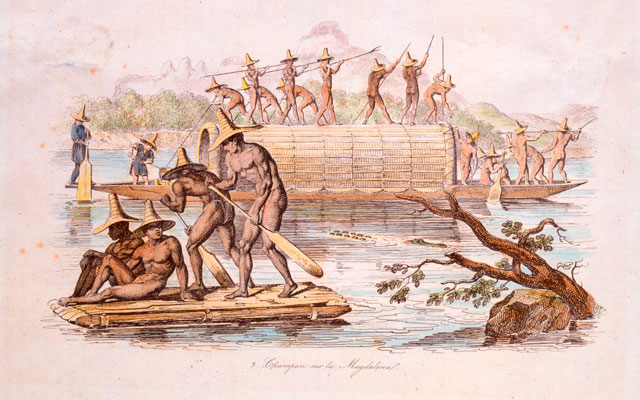 Hombres remando en el río Magdalena