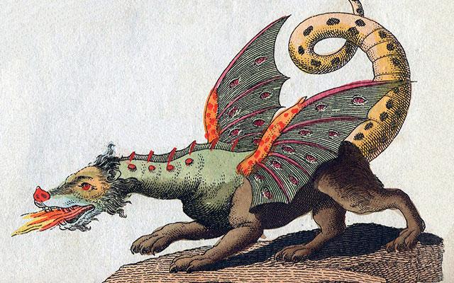 Un dragón alado que escupe fuego