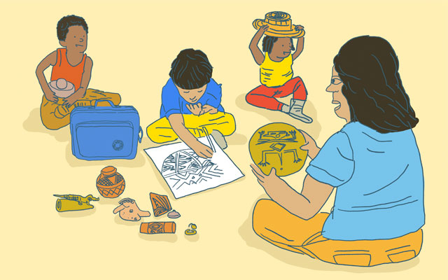 Mediador con maleta didáctica del Museo del Oro y grupo de usuarios